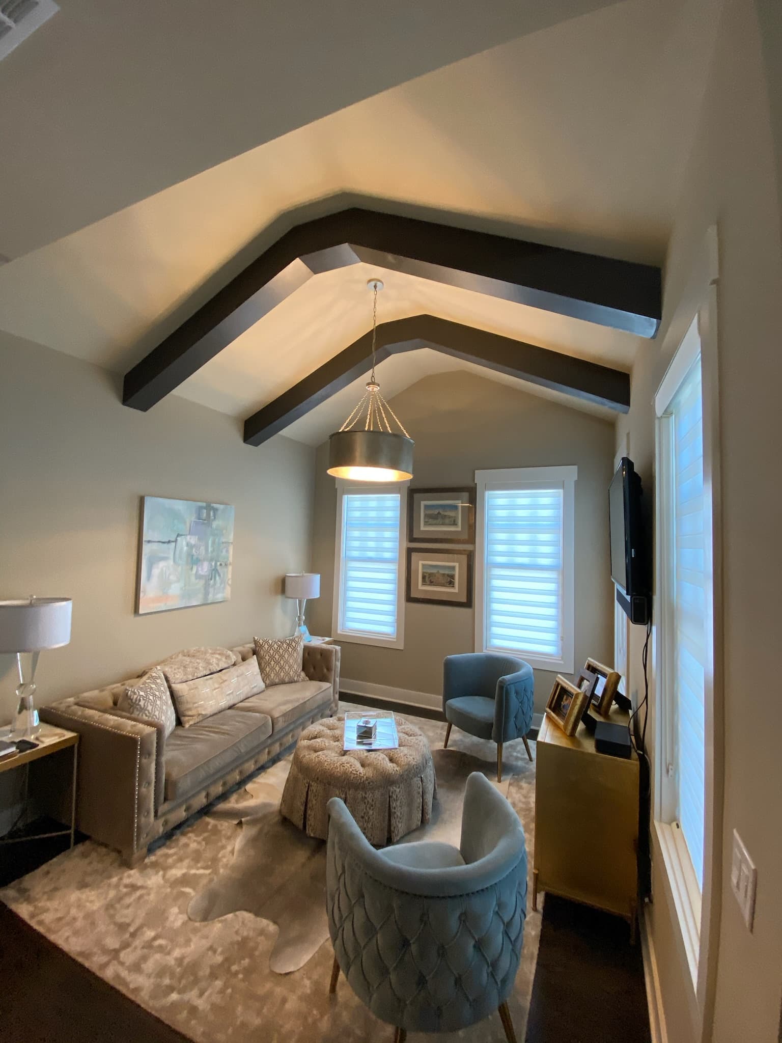 Finished dark-painted decorative ceiling beams in a Woodstock living room